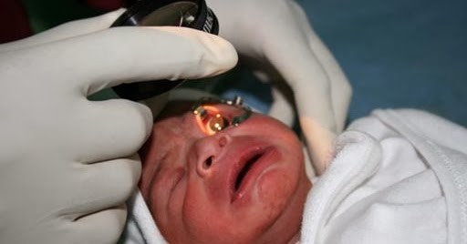 Figure 1b- Examination with indirect ophthalmoscope